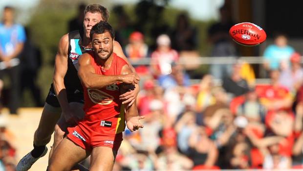 Karmichael Hunt in action for the Gold Coast Suns in an AFL match against Port Adelaide Power in 2012.