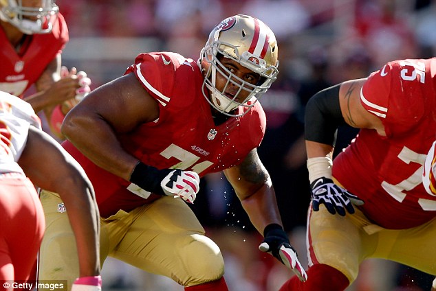 His girlfriend also told officials he'd been suicidal for about a month and 'writing on the walls of his home' (Pictured, Martin on the San Francisco 49ers in October 2014)