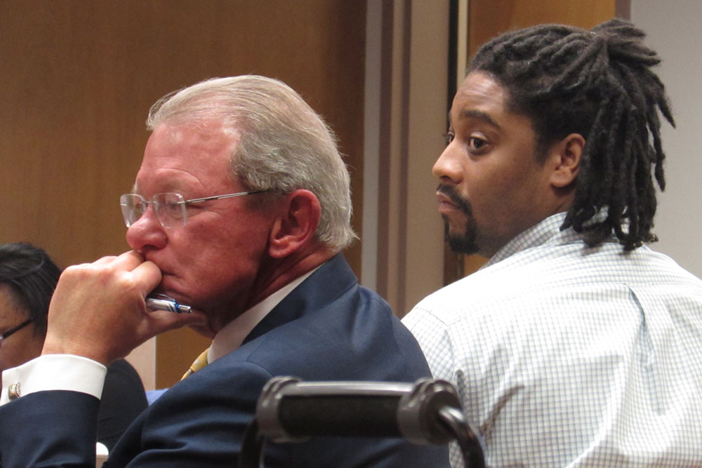 Attorney Michael Scott sits next to his client, Lavell White, in a Lompoc courtroom on Tuesday. White and another former basketball player from Allan Hancock College are charged with the fatal shooting of Terence Richardson, 23, in December 2014 in Santa Maria. The trial is taking place in Lompoc due to a clogged court calendar.