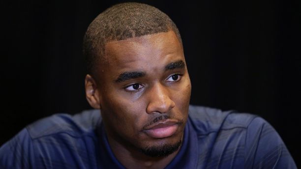 FILE - In this July 22, 2014, file photo, West Virginia cornerback Daryl Worley listens to a question during the Big 12 Conference NCAA college  football media days in Dallas. The governing body for college sports, the NCAA, lets individual schools determine domestic violence punishments. In one example from college football this week, Worley faces an indefinite suspension after being arrested and accused of grabbing a woman around the neck and shoving her to the ground at a nightclub.(AP Photo/File)