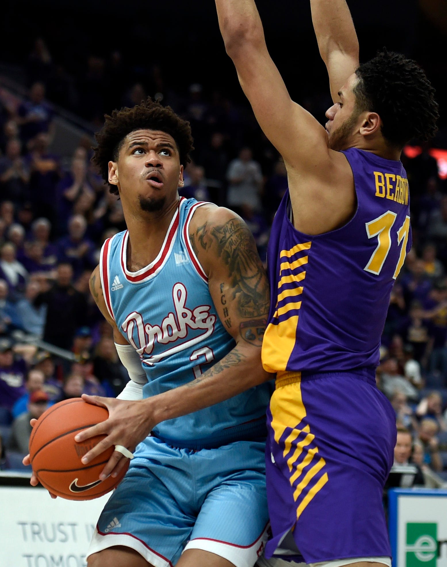 Mar 9, 2019; St. Louis, MO, United States; Northern Iowa Panthers guard Trae Berhow (11) defends against Drake Bulldogs forward Tremell Murphy (2) during the second half in the Missouri Valley Conference Tournament at Enterprise Center.