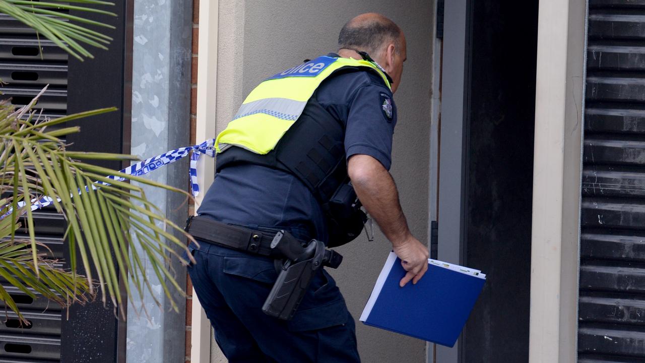 Police at the Lalor Street property in Port Melbourne this morning. Picture: Andrew Henshaw