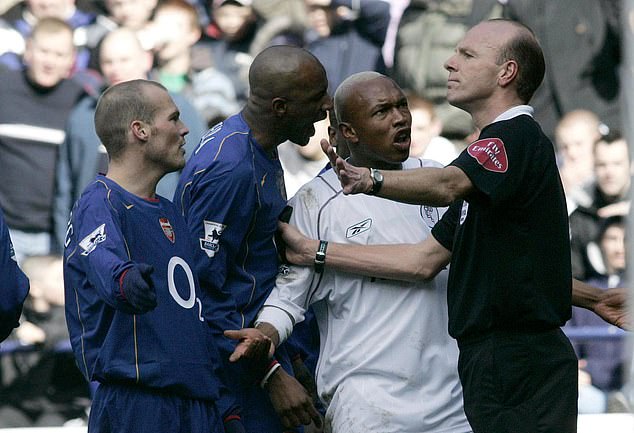 Arsenal captain Patrick Vieira has a word in Diouf's ear for a transgression during the cup tie