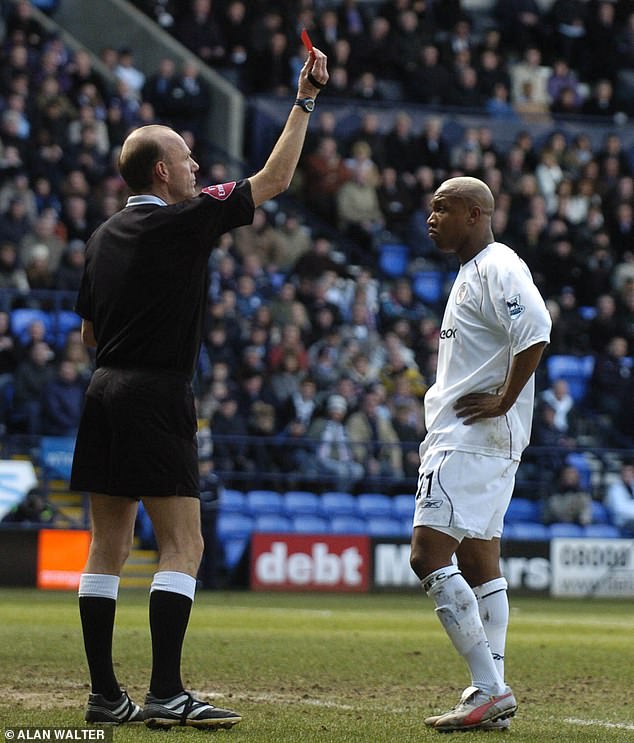 Diouf is shown a red card by referee Steve Bennett during a FA Cup tie against Arsenal