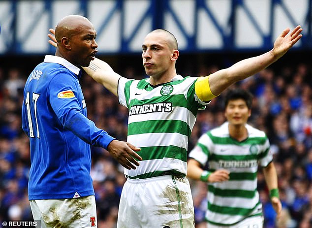 Celtic captain Scott Brown celebrates in Diouf's face after scoring in the Old Firm derby in 2011