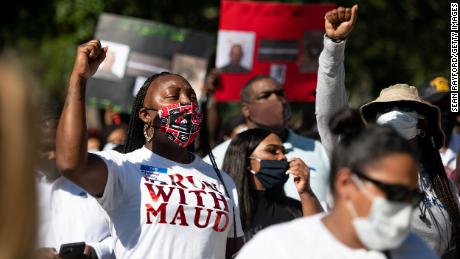 Demonstrators protest Arbery&#39;s shooting death outside the courthouse.