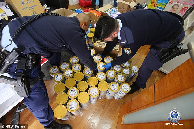 Above are dozens of baby formula tins that detectives located at her property yesterday