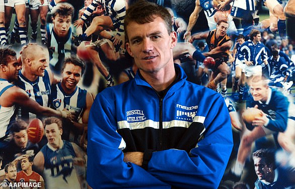 Laidley pictured when he signed as the coach of the North Melbourne Kangaroos in 2002 - signing a three-year deal with his former club