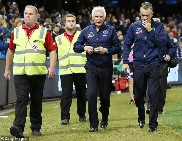 Dean Laidley (far right) as an assistant coach at Carlton with the team's head coach Mick Malthouse (third from left) in 2015. Malthouse said on Tuesday he had tried in vain to reach out to Laidley - who was arrested on Saturday and charged with stalking - in recent years