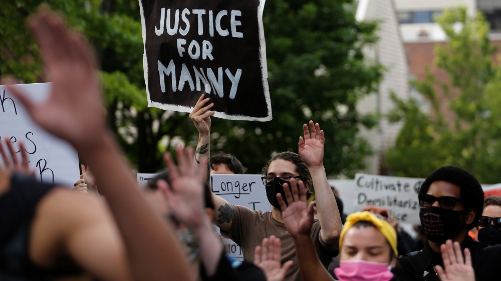 Protesters rally in Tacoma following the deaths of Manuel Ellis in Tacoma police custody and George Floyd in Minneapolis police custody