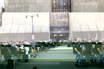 In this photo provided by WKBW, supporters of two suspended Buffalo police officers assemble outside the courthouse in Buffalo.